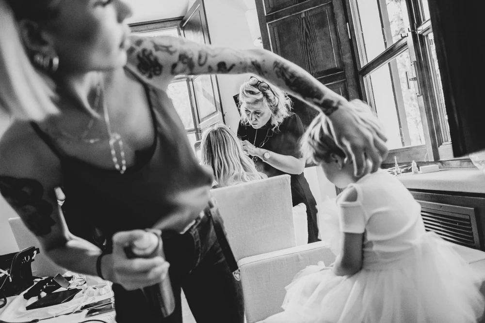In the dressing room, movement in the foreground and friends behind.