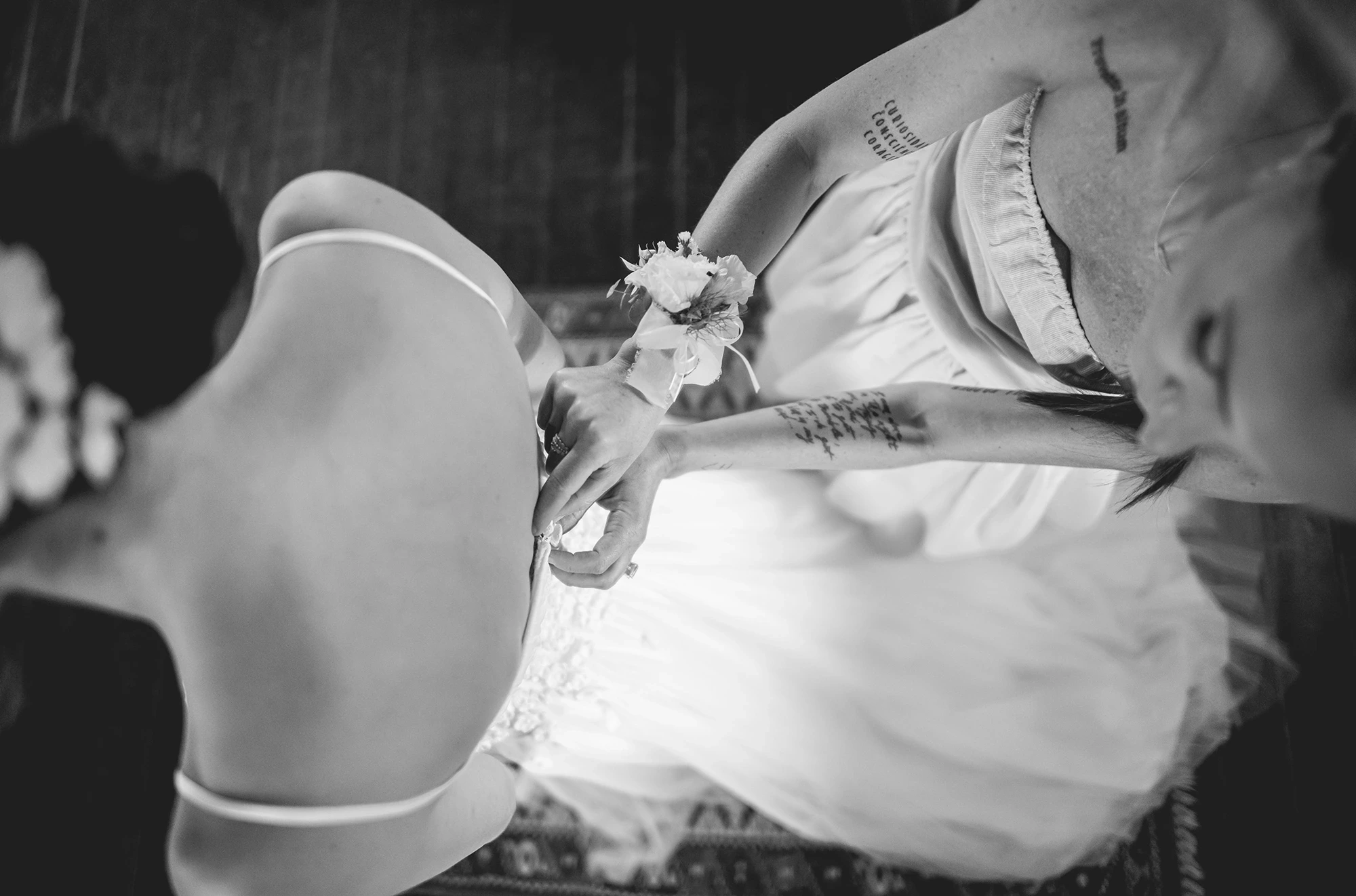 From above, hands adjusting the flower band at the wrist.