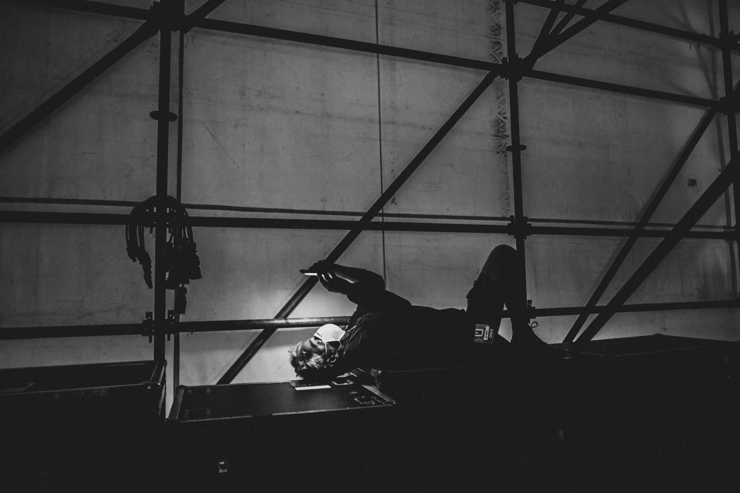 The piano beneath the stage cover, before the concert.