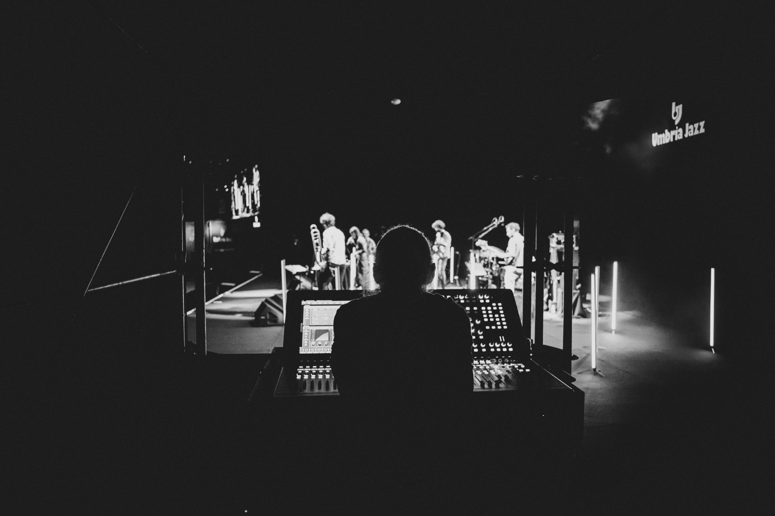 From the mixing desk, the lit stage at the end of the hall.