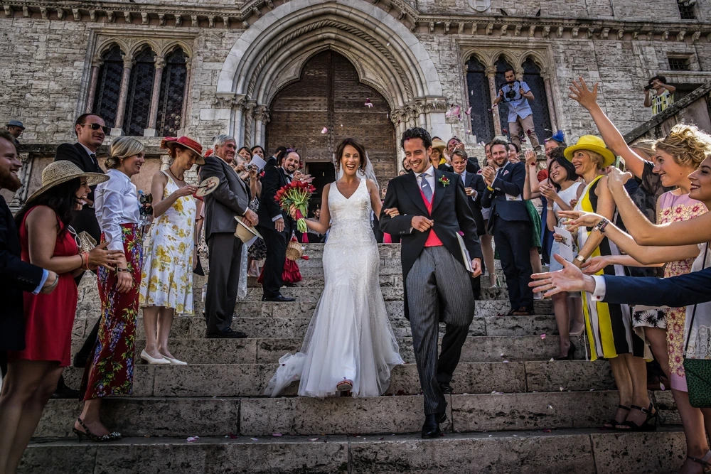 Leaving the church, down the steps through the rice.