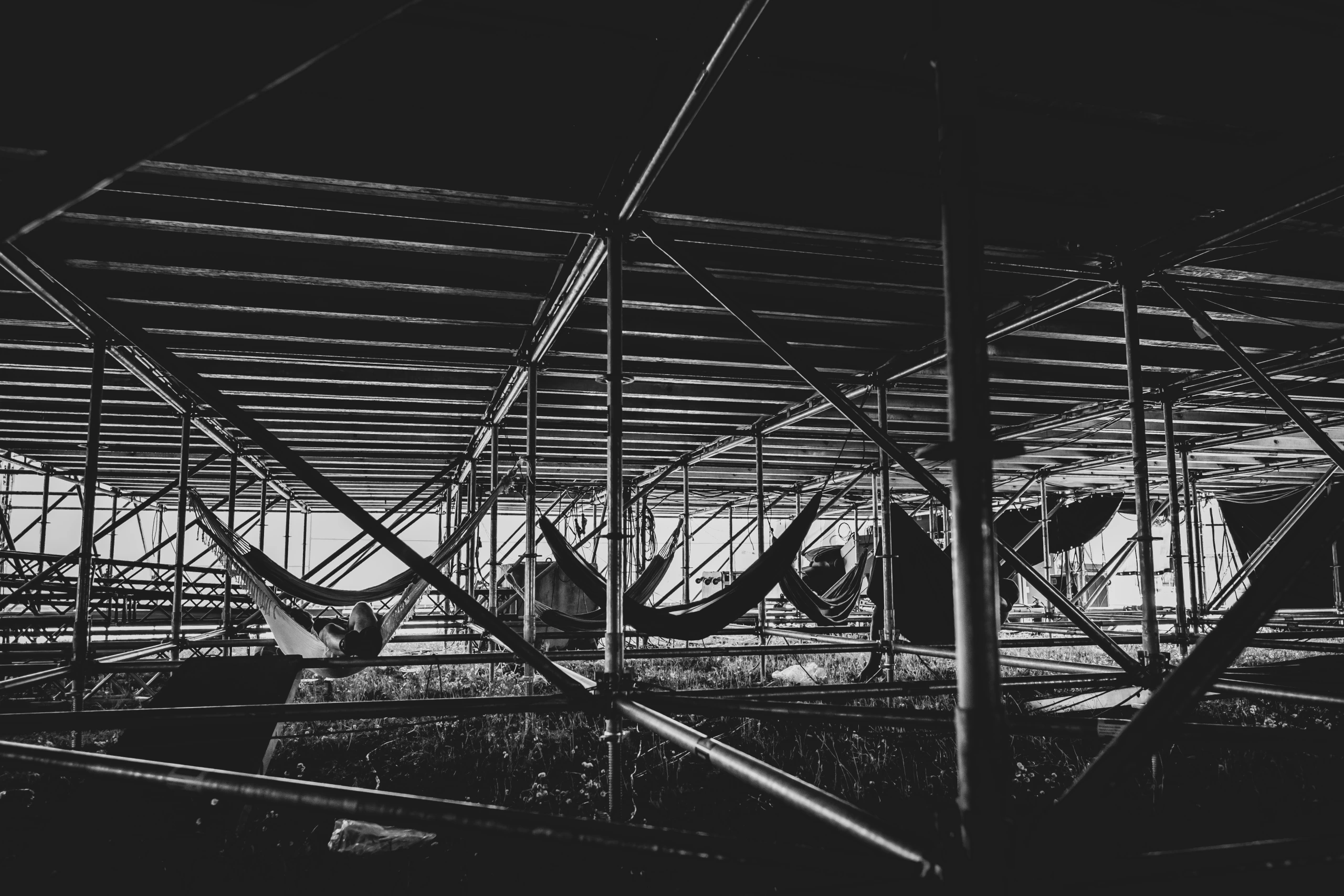 The underside of the stage roof, among the scaffolding poles.