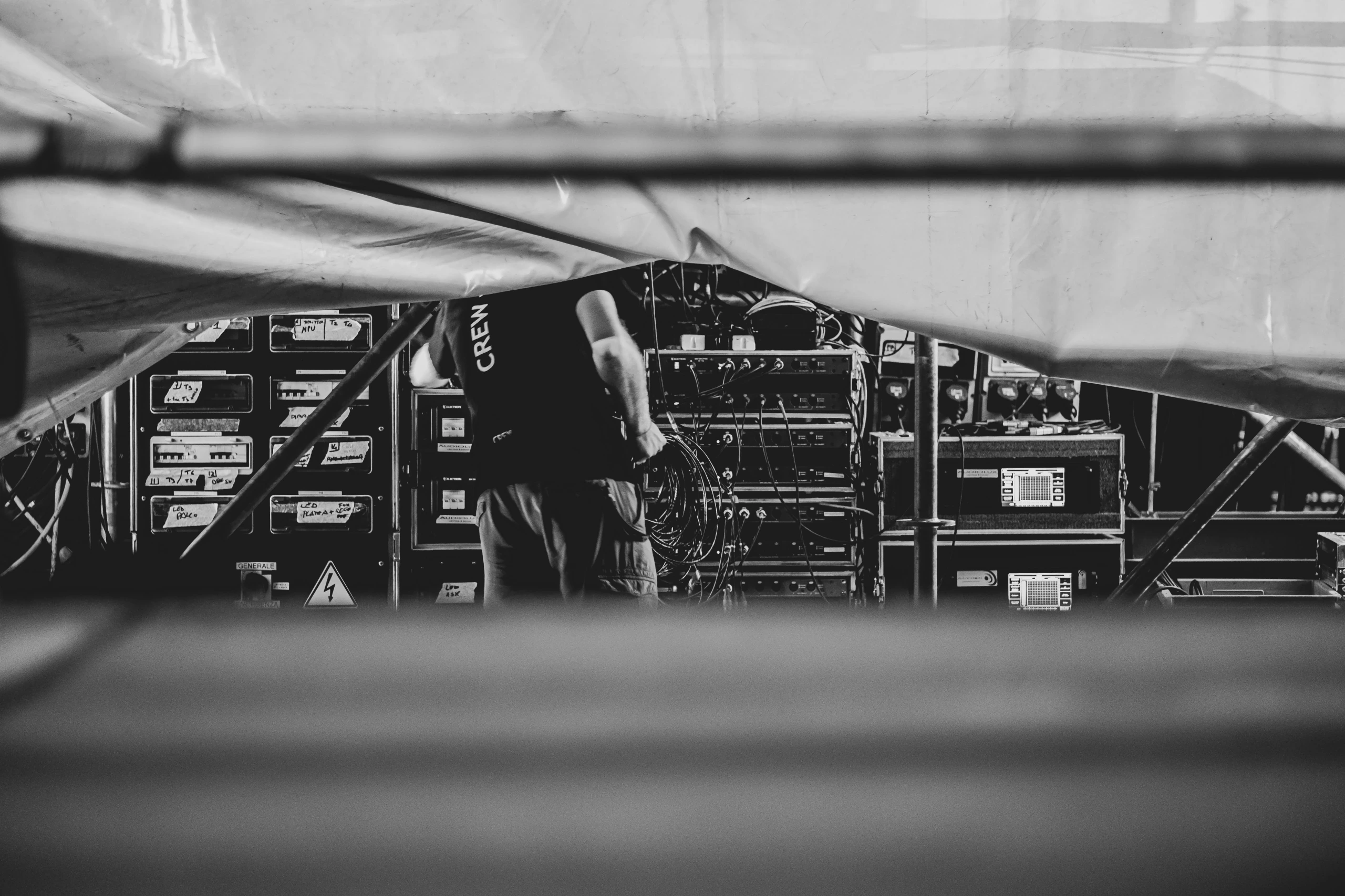 A crew member among the equipment racks.