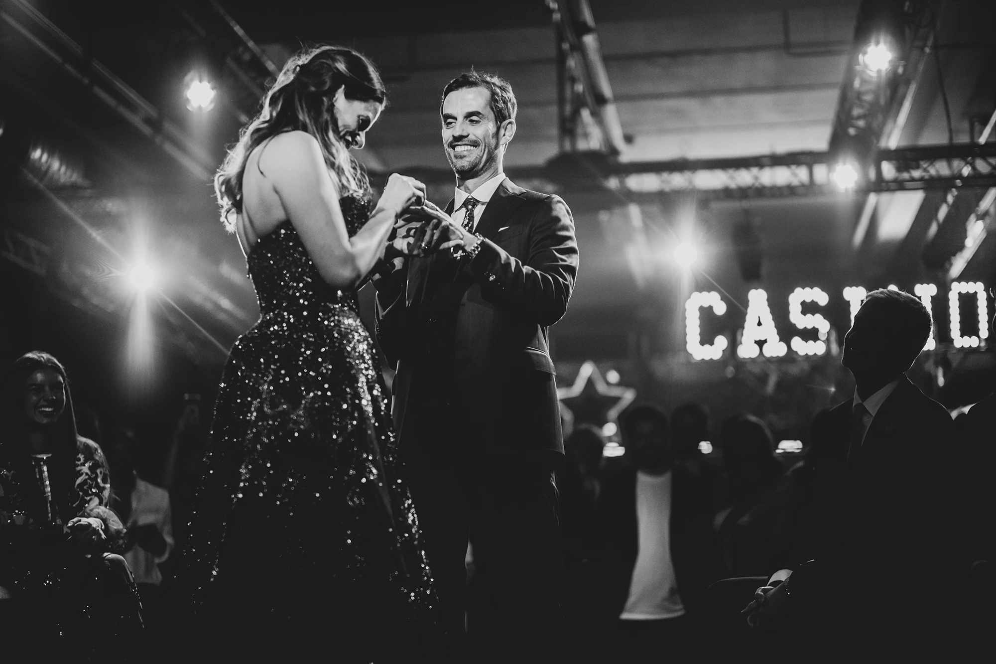 Beside the illuminated letters, the couple's dance.