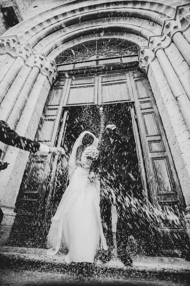 The kiss beneath the doorway, in the shower of rice.