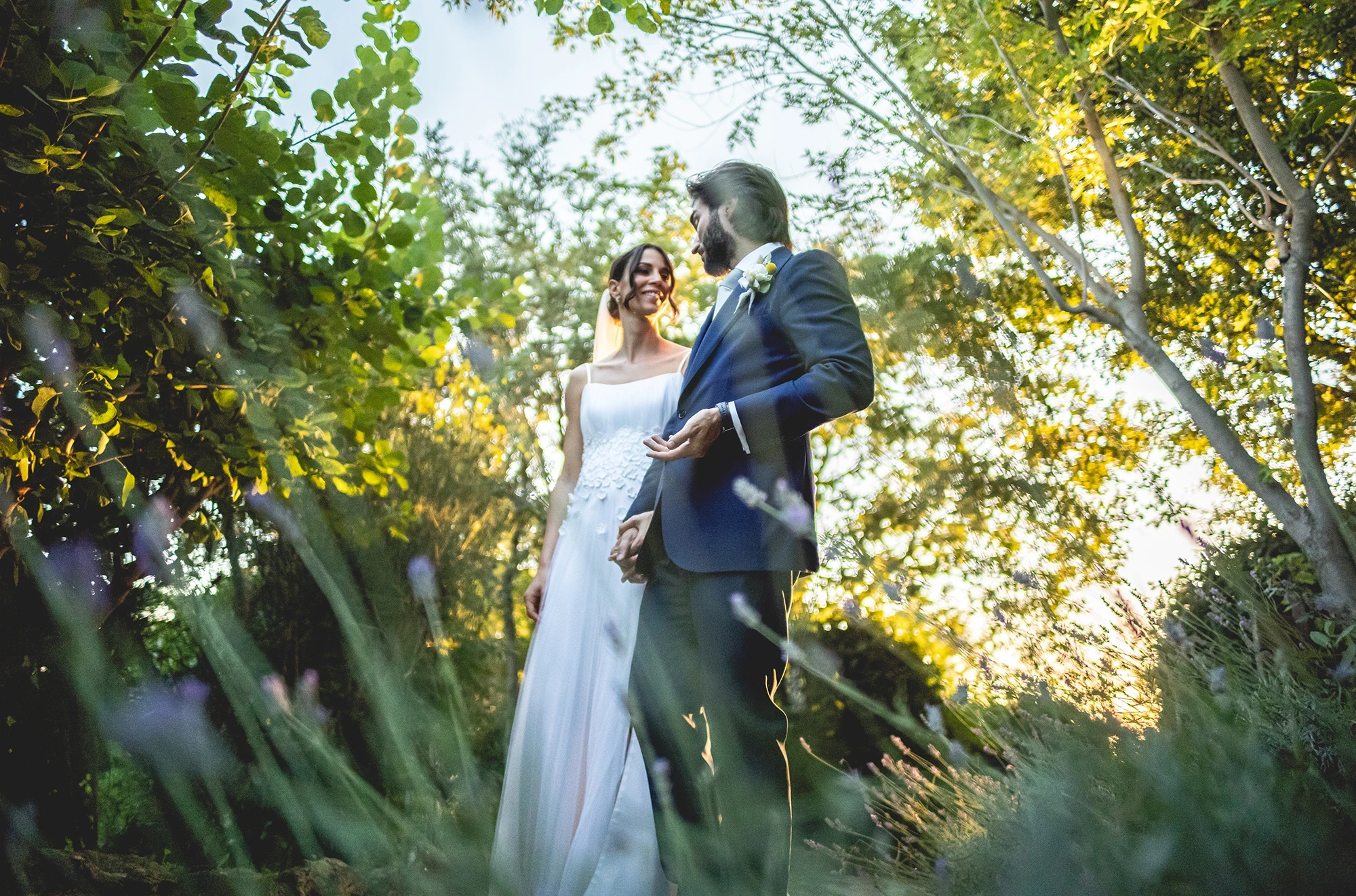 Among the trees and the tall grass, in golden light.