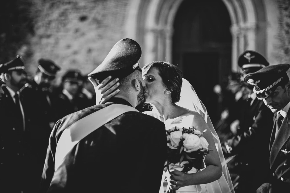 A kiss among the officers' sabres.