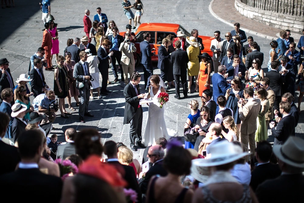 From above, the crowd of guests around the couple in the street.