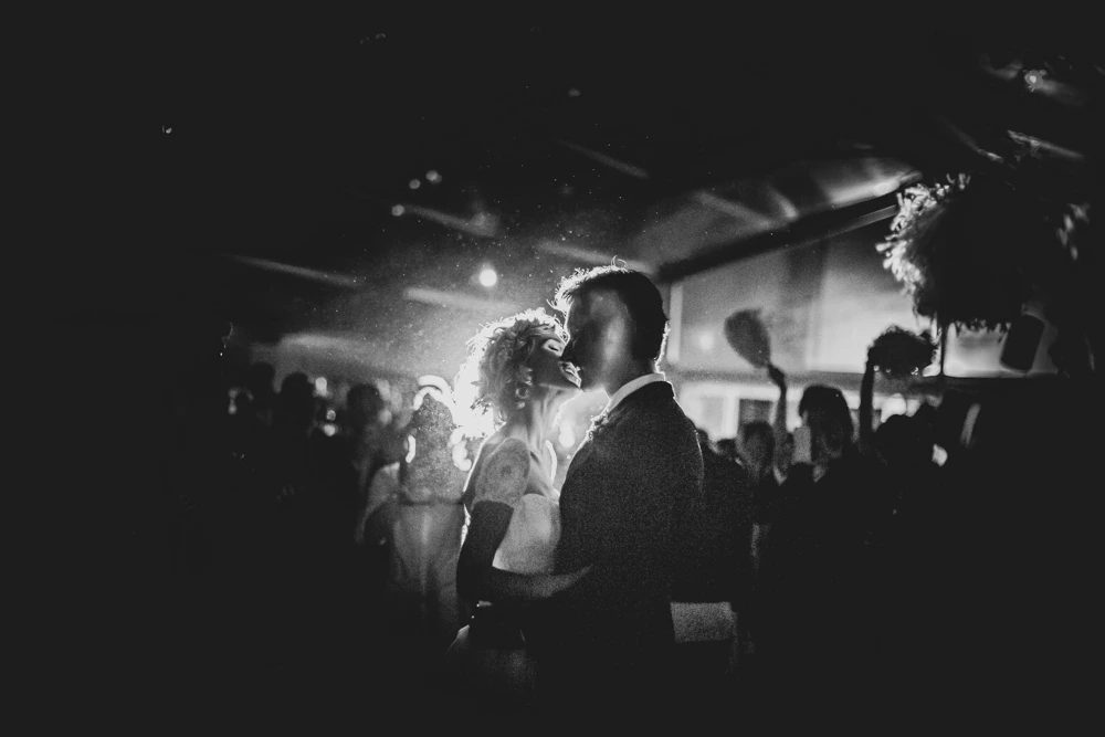 In the darkened hall, the dance lit from behind.