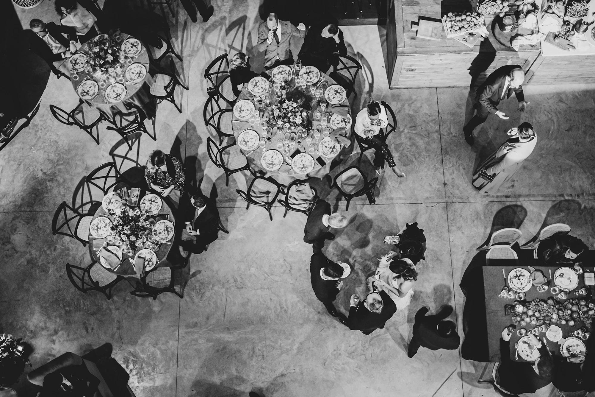 From above, the round tables laid with flowers.