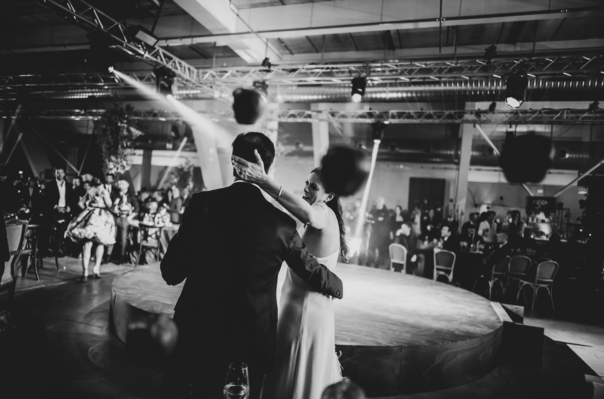 On the round stage, the couple's dance among the guests.